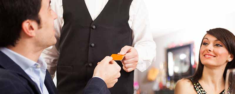 Man paying dinner in a restaurant|Man paying dinner in a restaurant